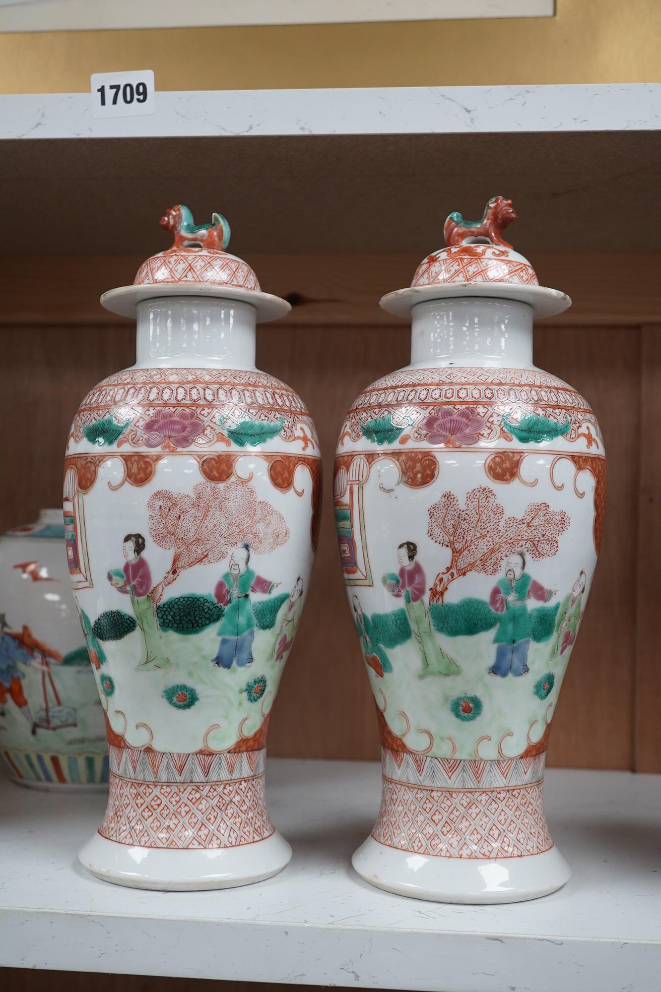 A group of Chinese ceramics to include a pair of early 20th century famille rose vases and covers, a 19th century blue and white crackle glazed vase etc, largest 31cm high. Condition - mostly fair, a few chips and cracks